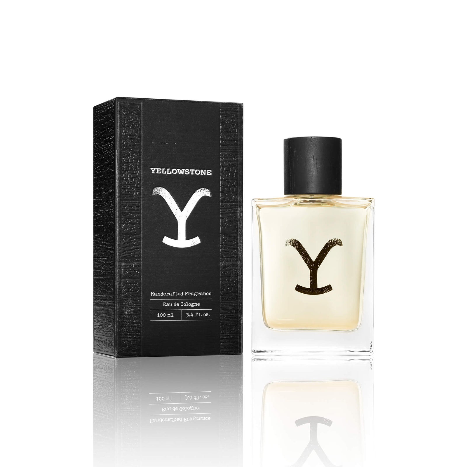 A bottle of Tru Western Men's Yellowstone cologne with its packaging box. The bottle is clear with a yellowish liquid inside and the box is black with the letter 'Y' in white.
