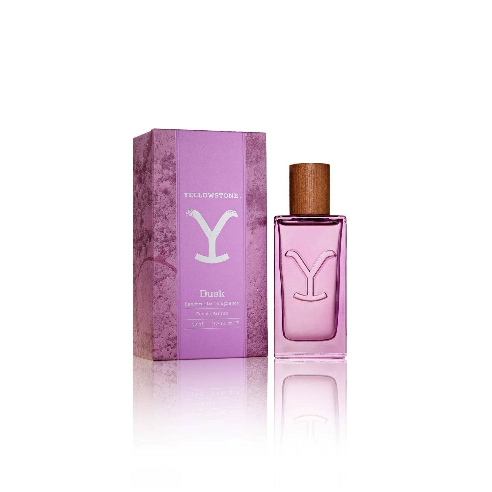 Tru Western Women's Yellowstone Dusk Eau De Parfum in a purple bottle with a matching purple box, featuring a ranch-inspired design.
