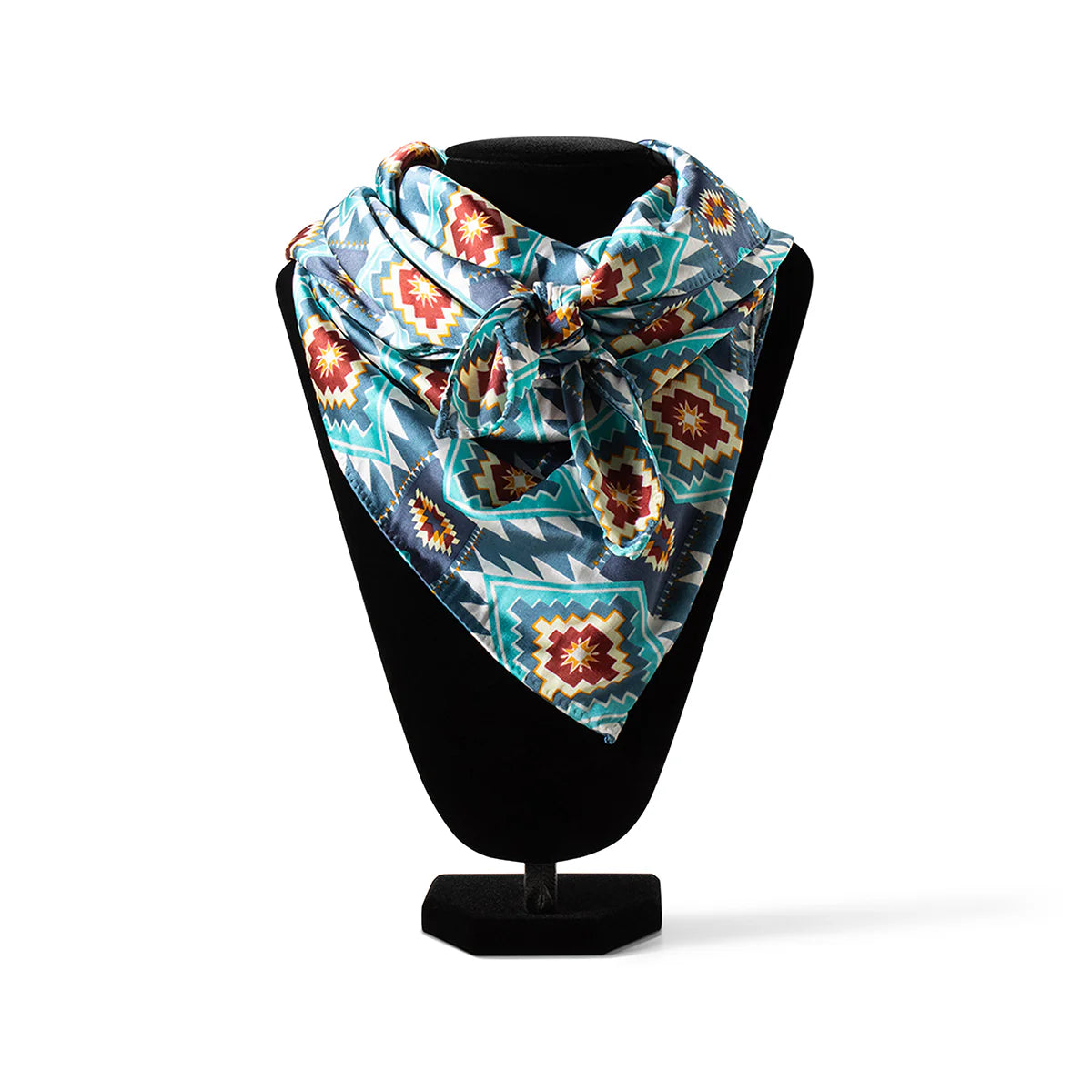 Ariat Southwest Blue Wild Rag. Colorful patterned scarf on a black stand against a white background