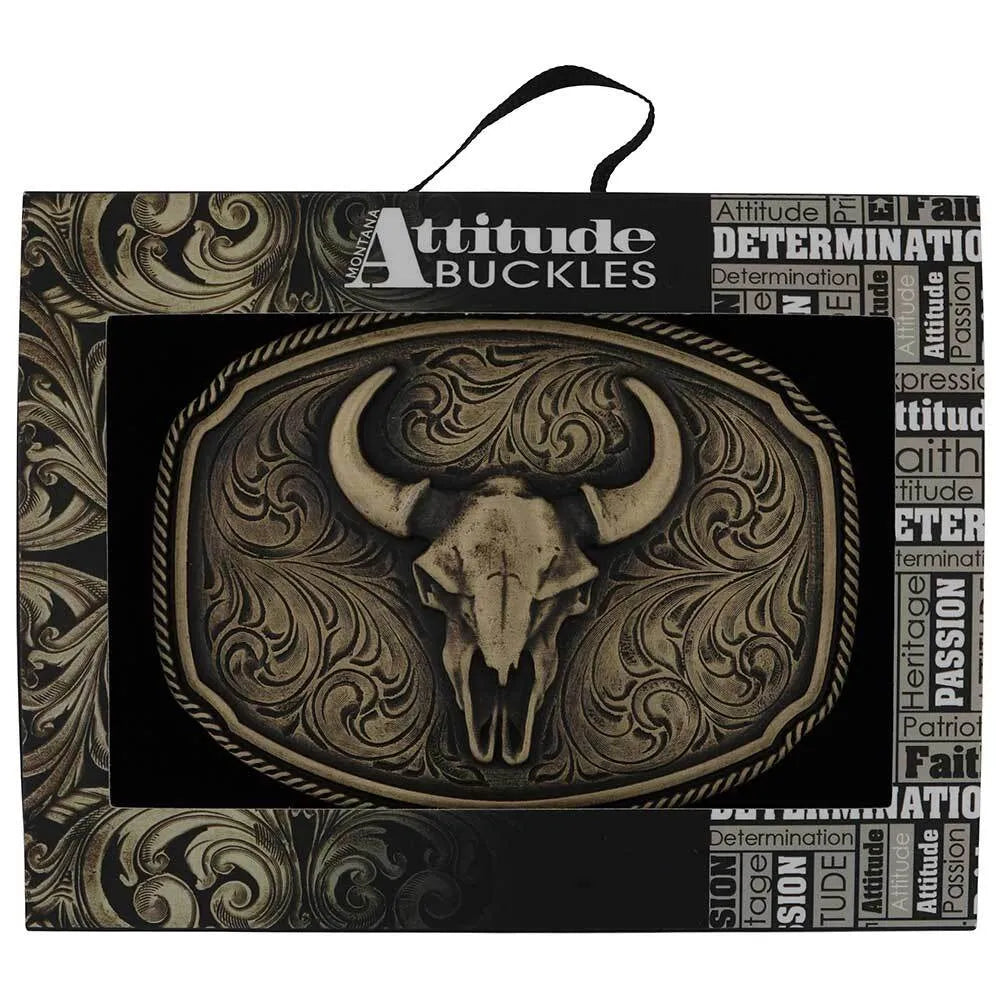 Montana Silversmith Wild Ambition Buckle. Bull skull belt buckle in decorative packaging with 'Attitude Buckles' branding.