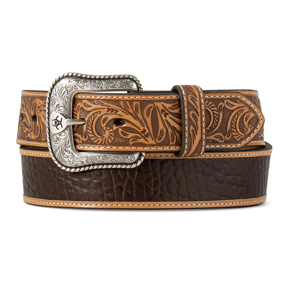 Brown leather belt with intricate design and silver buckle on a white background
