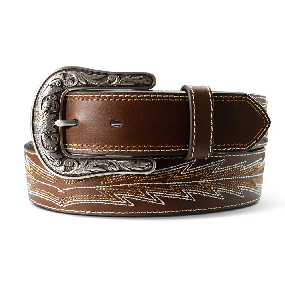 Brown leather belt with intricate silver buckle on a white background