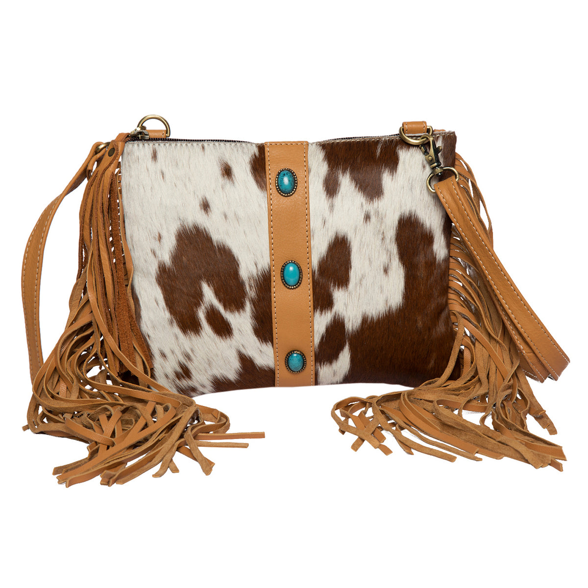 Brown and white cowhide leather handbag with fringes and turquoise buttons on a white background