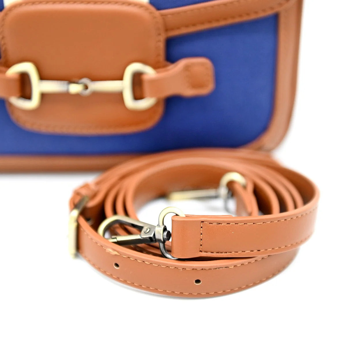 Bahamas Clutch Purse - Navy. Blue and brown crossbody bag with a strap on a white background