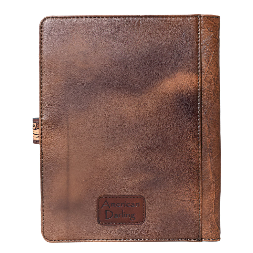 Brown leather notebook cover with 'American Darling' branding on a white background