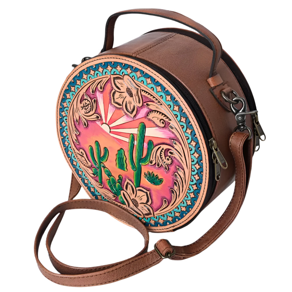 American Darling tooled leather western style handbag with a canteen shape, featuring a colorful floral and cactus pattern, solid brown background, and a brown leather shoulder strap.