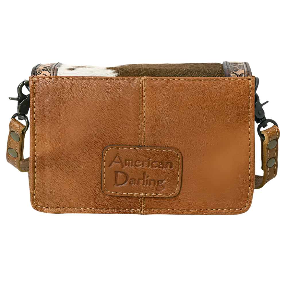 Brown leather pouch with 'American Darling' branding on a white background