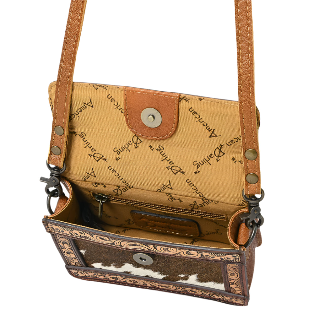 American Darling Brown leather crossbody bag with decorative interior on a white background