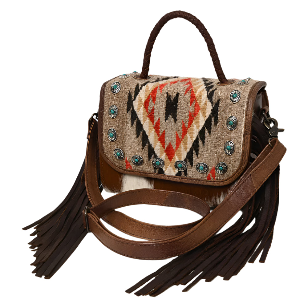 American Darling  brown leather crossbody bag with a western saddle blanket design, featuring fringe detailing and a shoulder strap.