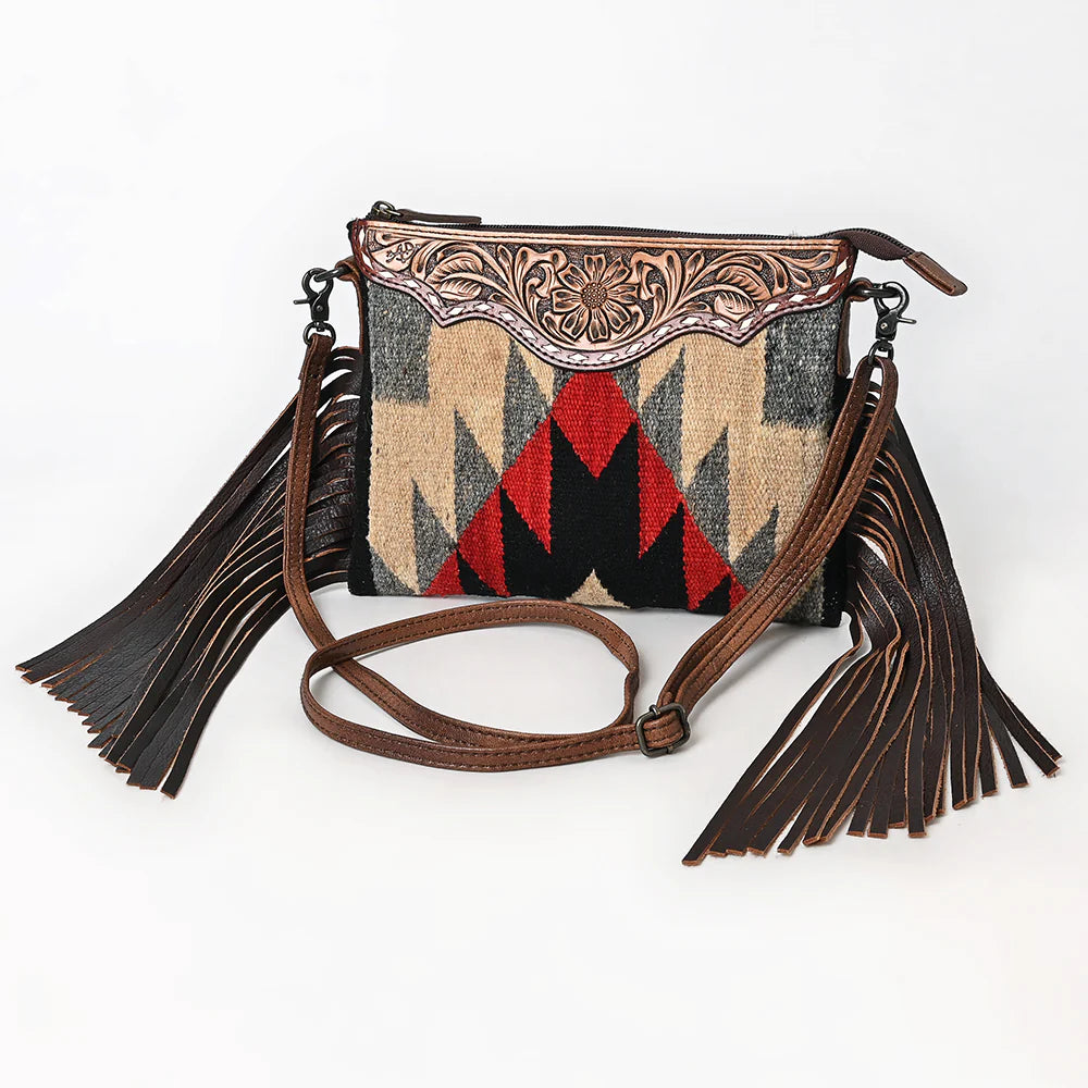 American Darling Southwestern Wool Crossbody Handbag. Handbag with geometric pattern and tassels on a white background