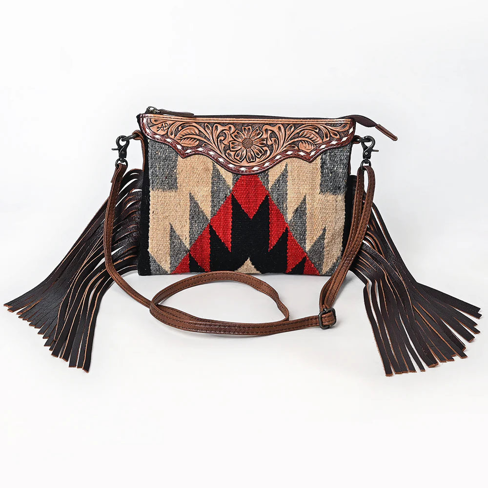 American Darling Southwestern Wool Crossbody Handbag. Handbag with geometric pattern and fringes on a white background
