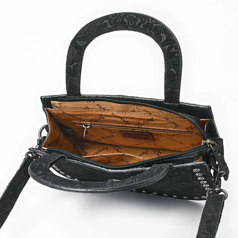 American Darling Suede Western Tote. Black floral patterned handbag with decorative handle on a white background