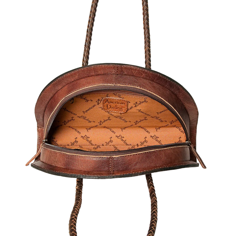 American Darling Tooled & Hide Western Tote. Brown leather handbag with decorative interior on a white background