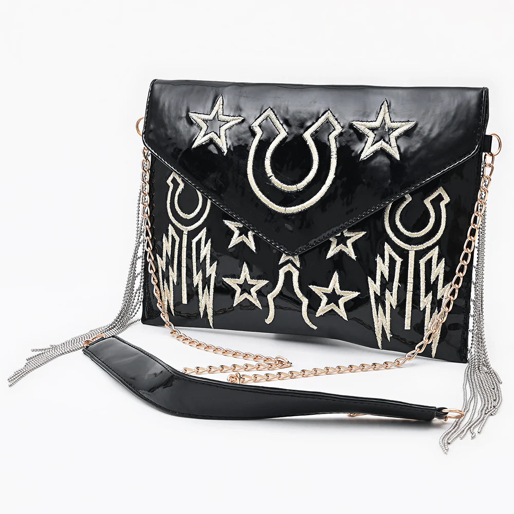 American Darling Rock &amp; Roll Western Handbag. Black handbag with star and moon designs on a white background