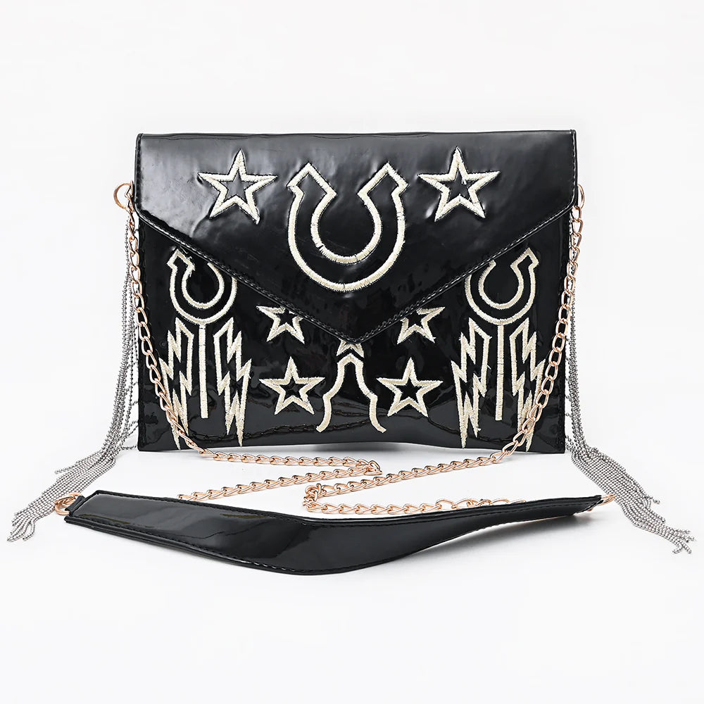 American Darling Rock & Roll Western Handbag. Black handbag with white star and moon designs on a white background
