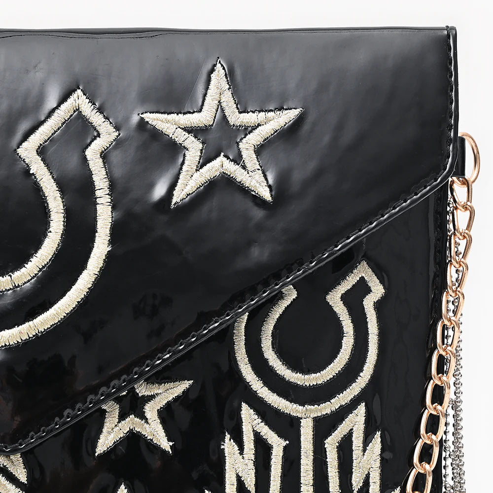 American Darling Rock & Roll Western Handbag. Black handbag with white star and crescent moon designs on a chain strap.