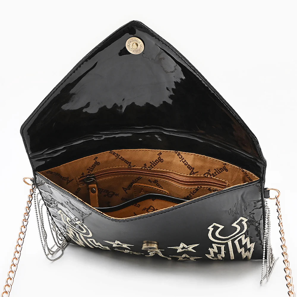 American Darling Rock & Roll Western Handbag. Black handbag with star and moon designs on a white background