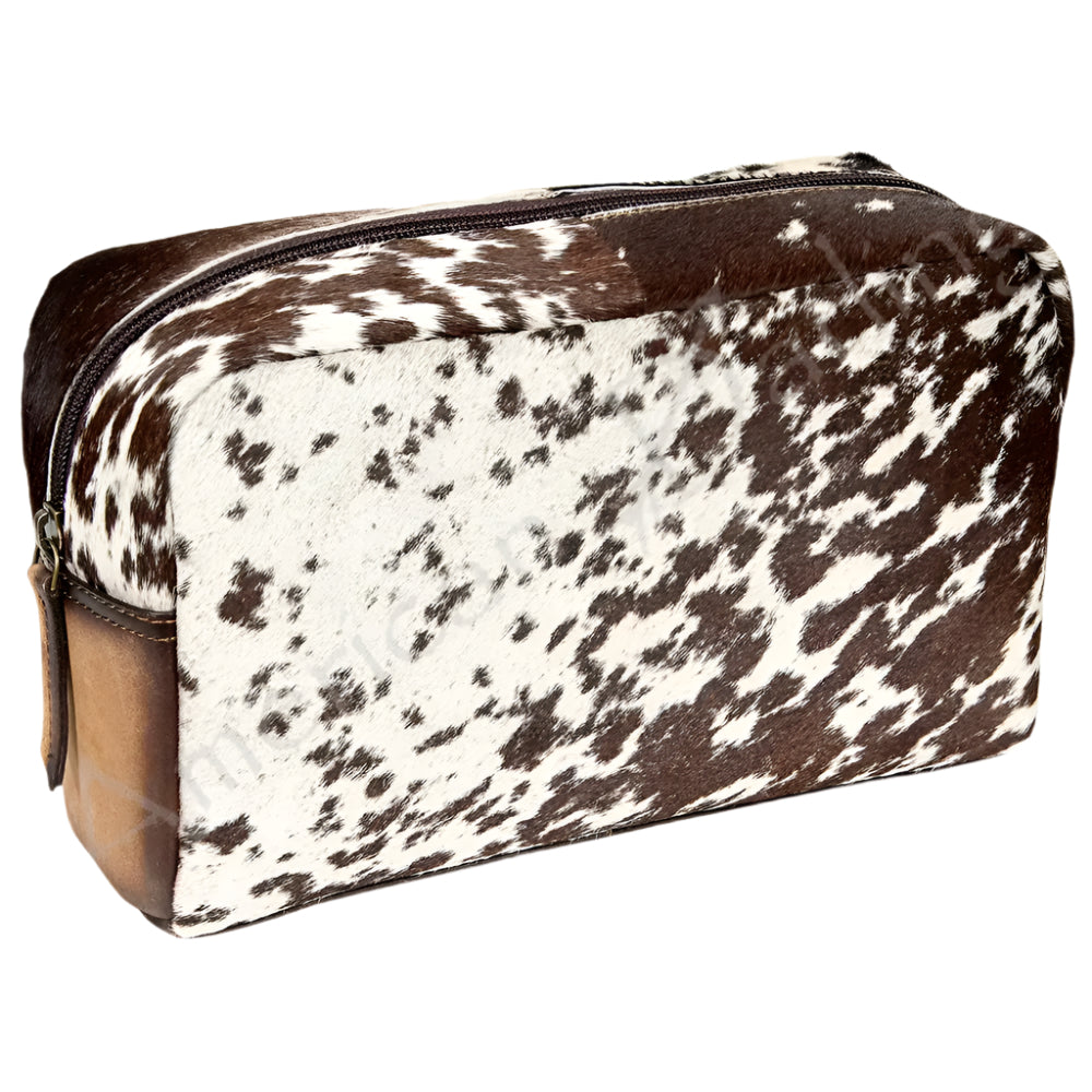 American Darling Cow print toiletry bag with brown accents on a white background