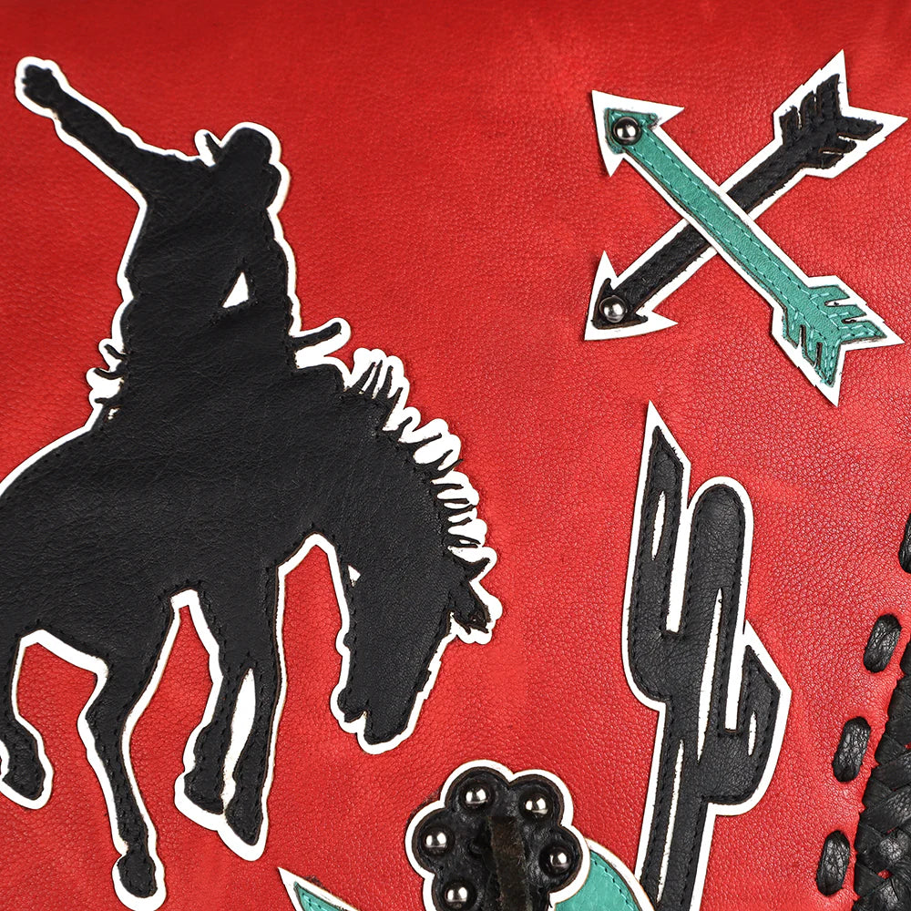 American Darling Cowgirl Statement Western Rodeo Messenger Bag. Decorative fabric with a silhouette of a person on a horse, crossed arrows, and cacti on a red background.