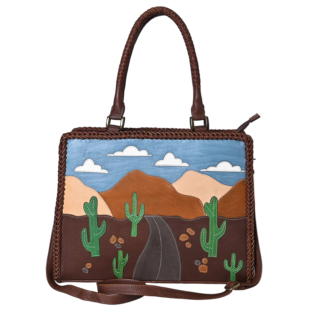 American Darling Desert Road Applique Western Tote. Handbag with a desert landscape design featuring cacti and mountains on a white background