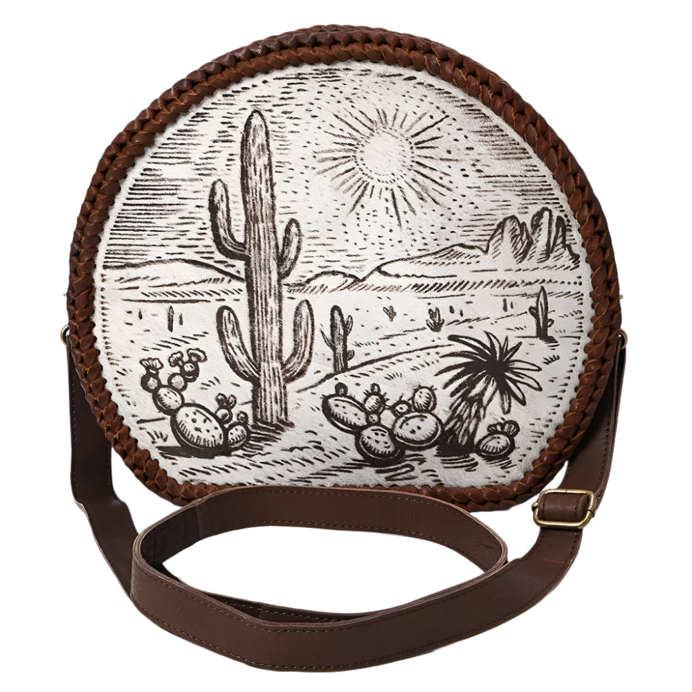 American Darling Round crossbody western bag with desert scene design and brown leather strap on a white background