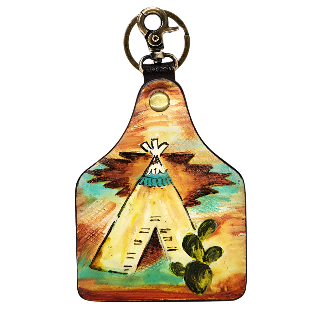 American Darling Leather keychain with a painted design of a teepee and cactus on a white background