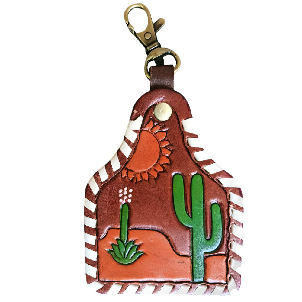 American Darling western leather keychain with desert design featuring a cactus and sun on a white background