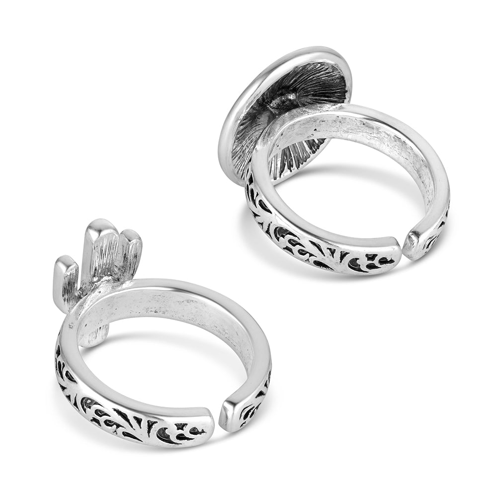 Pair of silver hoop earrings with intricate designs on a white background