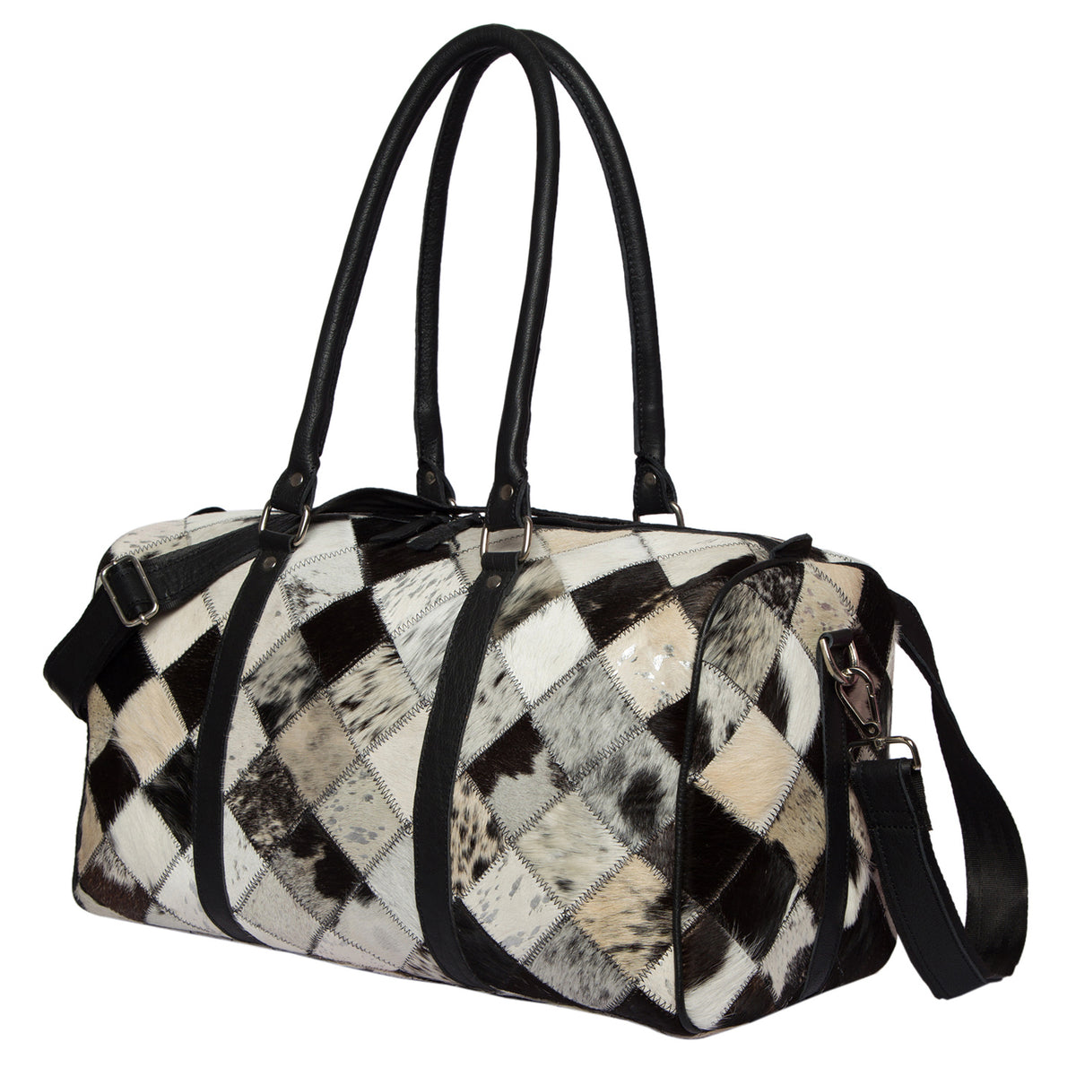 Women&#39;s Patchwork Cowhide Travel Bag. A black and brown patchwork cowhide travel bag with leather piping, a detachable shoulder strap, and dual hand straps.