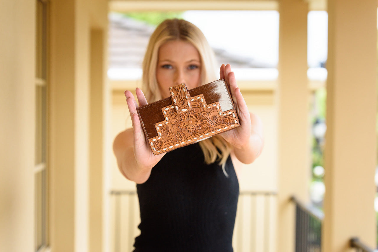 Women's Manta Tooling Leather Slim Button Wallet. A multicolor leather wallet with intricate hand tooling and a magnetic button closure.