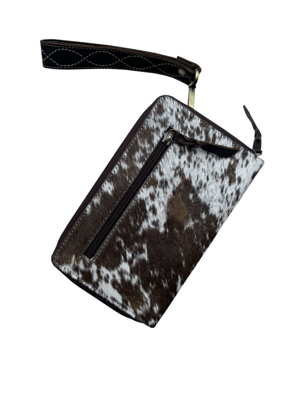 Tooling Leather Cowhide Boot Stitch Clutch Wallet. Cow print pouch with black zipper on a white background