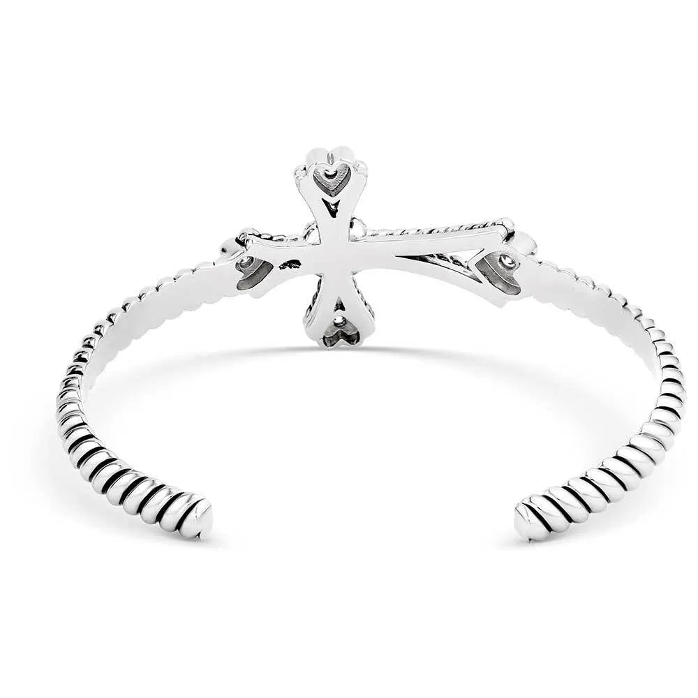 Silver bracelet with a unique design on a white background
