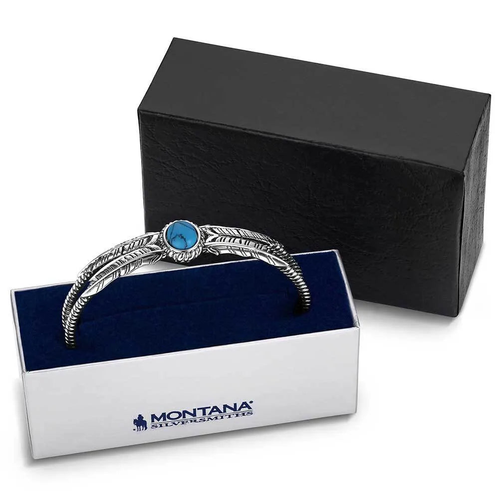 Montana Silversmith a bold crafted turquoise stone anchors the center of the silver tone cuff. 