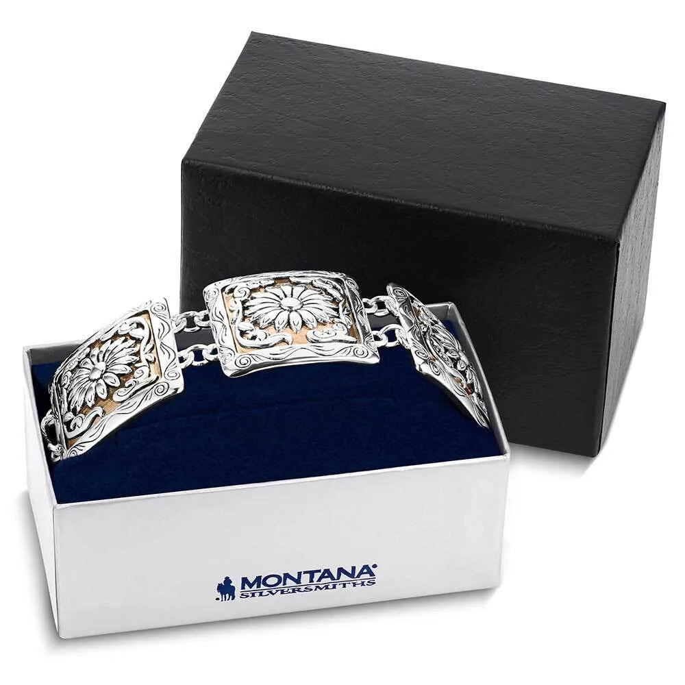 Silver bracelet with floral designs in a 'Montana Silversmiths' box