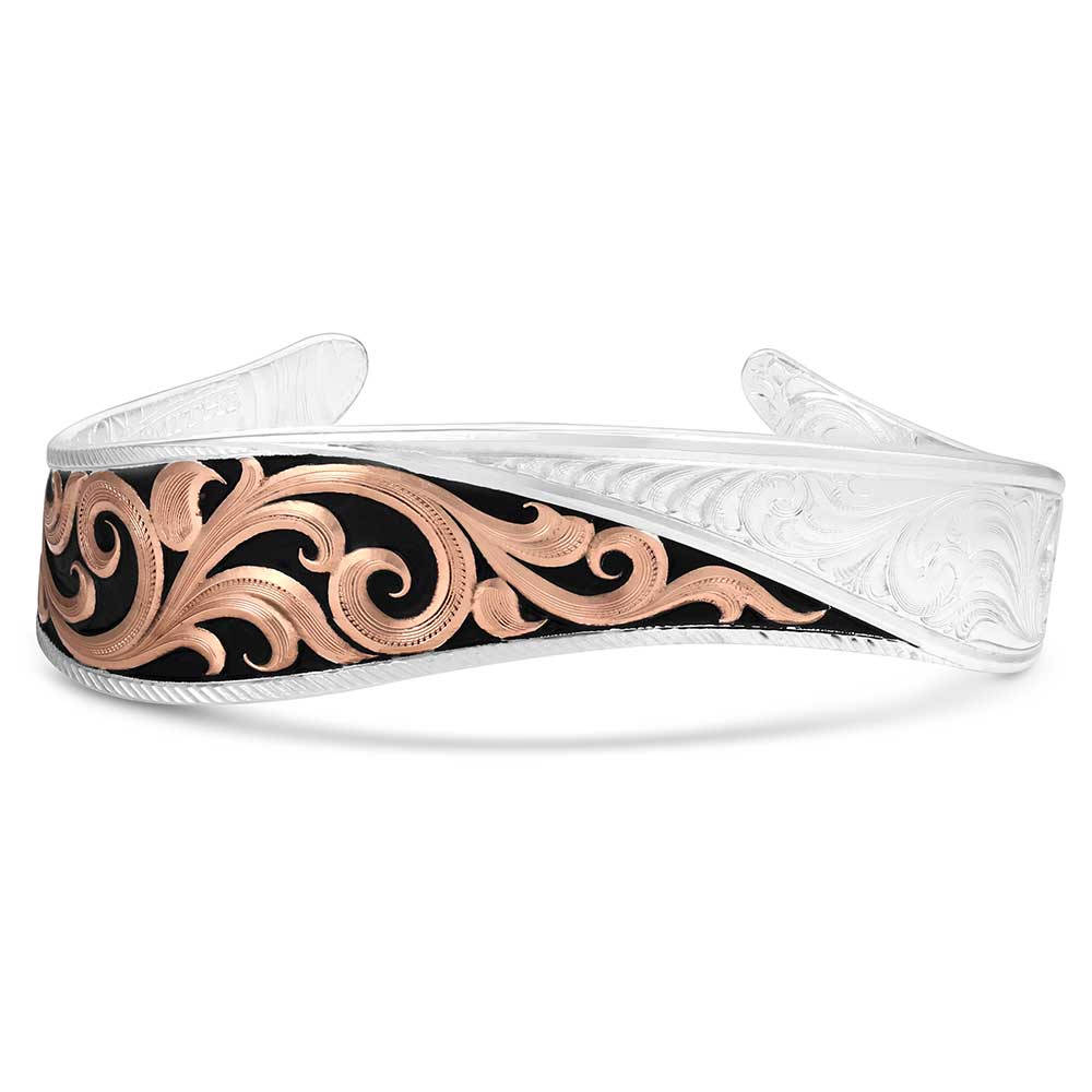 Decorative headband with rose gold and black design on a white background