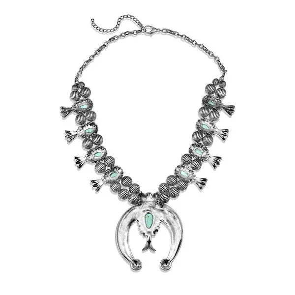 Necklace with horsehead pendant and beaded design on a white background