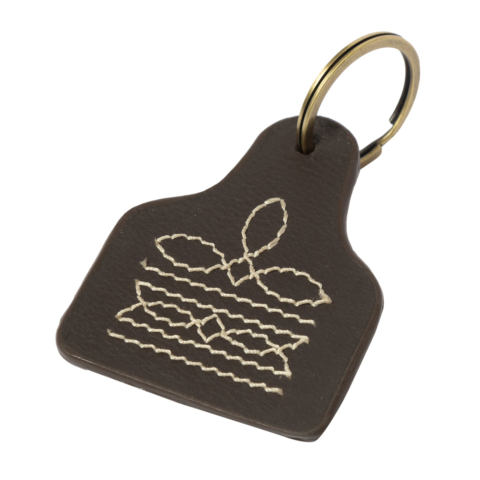 Brown leather keychain with white embroidered design on a white background