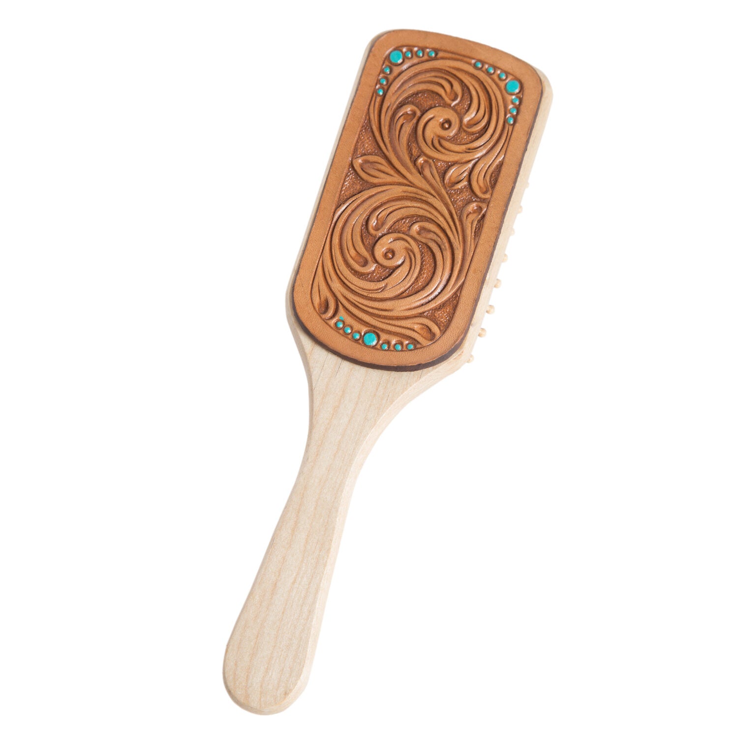 Women's Tooling Leather Hairbrush. A tooling leather hairbrush with intricate hand-carved patterns and a wooden handle.