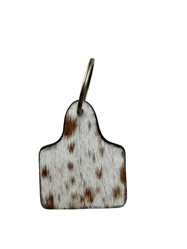 Tooling Leather Hand Painted Cattle Tag Keyring. Decorative keychain with turquoise and brown design on a white background