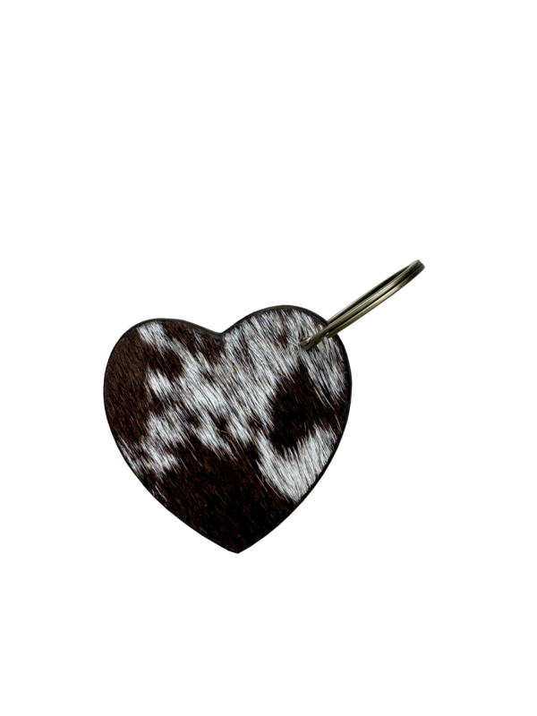 Buck Stitch Tooling Leather Heart Keyring. Heart-shaped pendant with intricate design on a white background