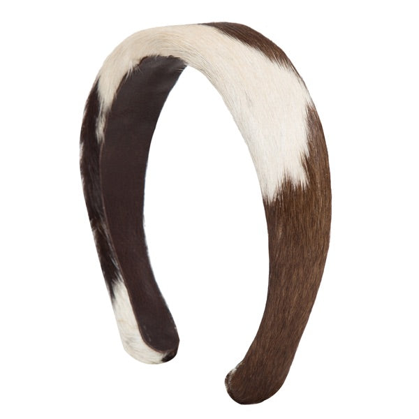 Cowhide Hairband. Brown and white hairband on a white background