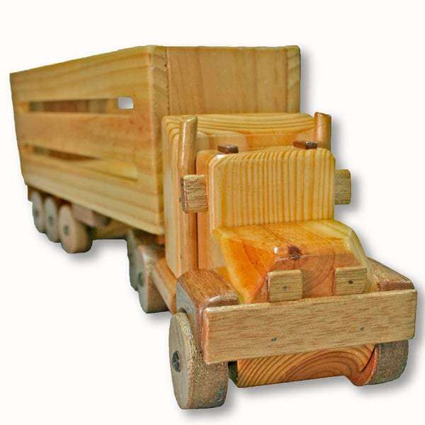 Country Toys CT1 Wooden Cattle Truck. Handmade wooden toy truck with a detachable trailer, made from natural wood with visible grain.