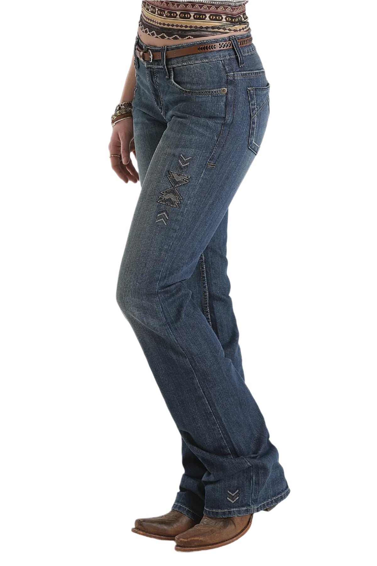 Cruel Denim Women's Abby Trend Jean. Person wearing blue jeans and brown boots on a white background 