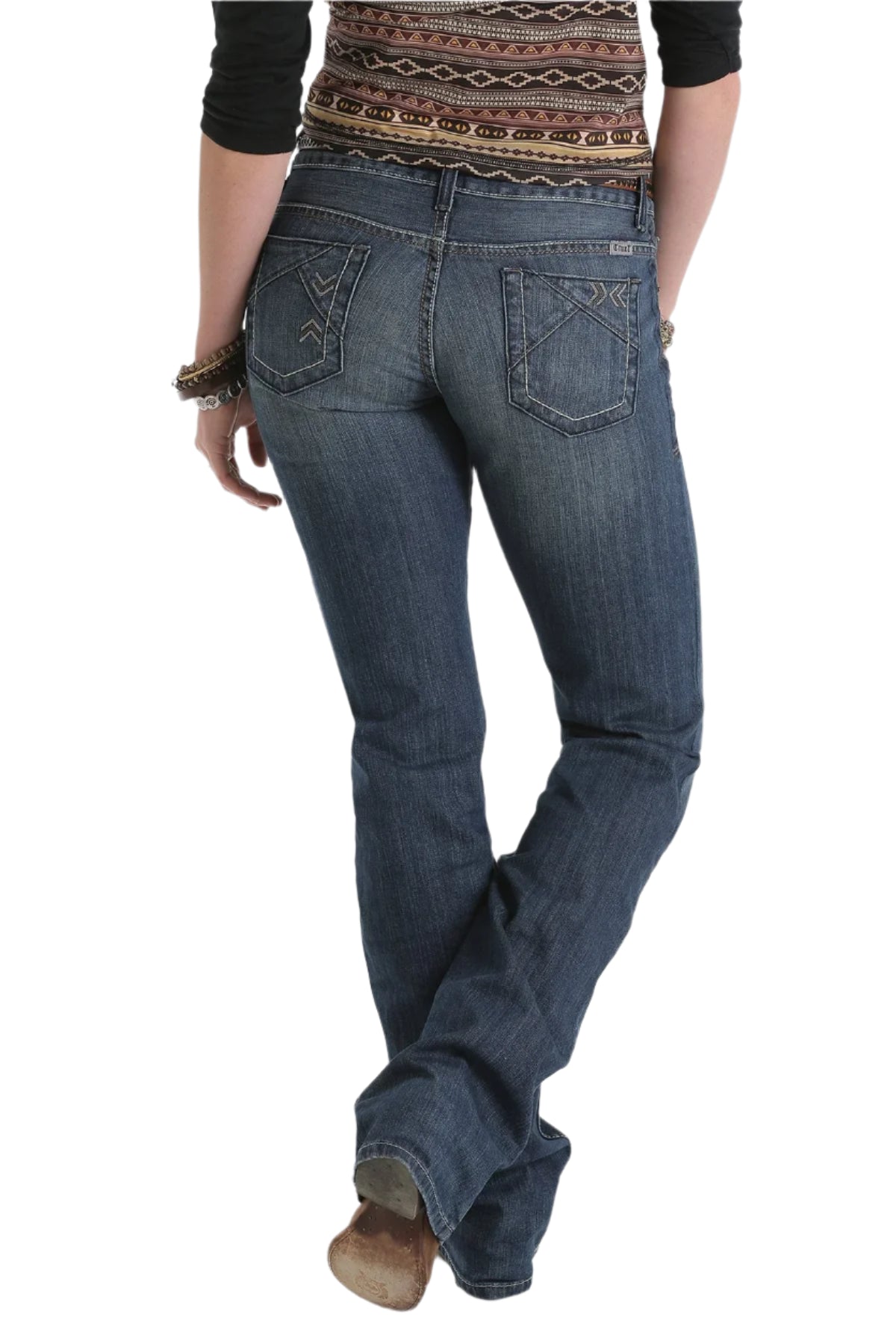 Cruel Denim Women's Abby Trend Jean. Person wearing blue jeans and brown boots on a white background 