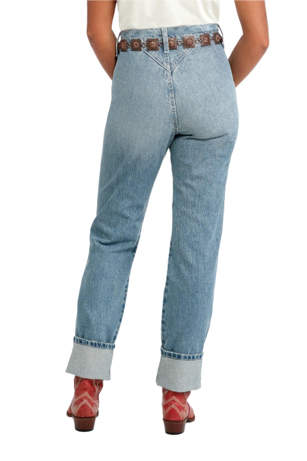 Cruel Denim Women's Quinn Relaxed Fit Jean. Person wearing light blue jeans with a brown belt on a white background