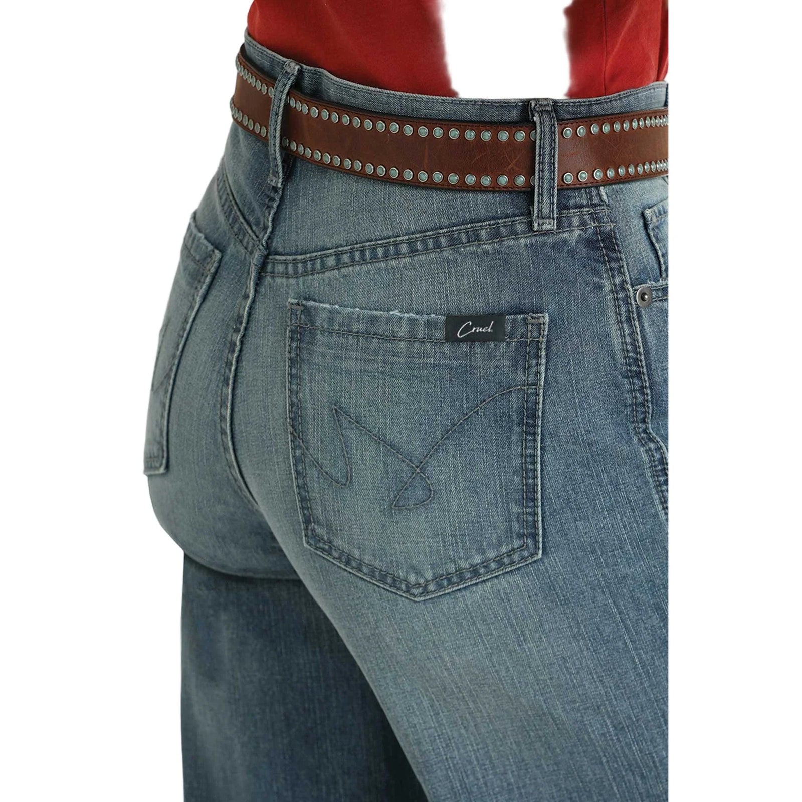 Cruel Denim Casey Medium Stone High Rise Loose Jeans. Blue jeans worn by a person on a white background