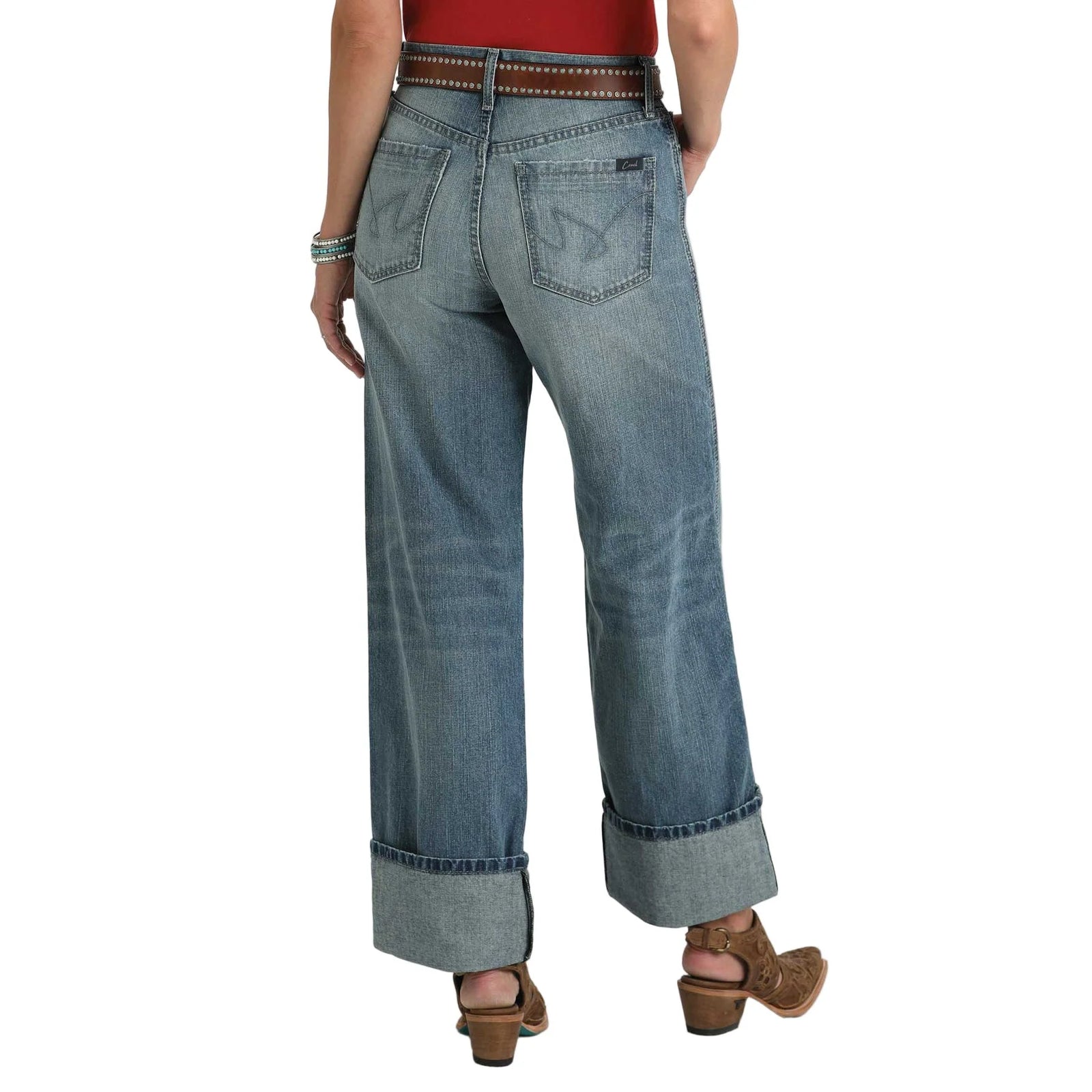 Cruel Denim Casey Medium Stone High Rise Loose Jeans. Blue jeans worn by a person on a white background