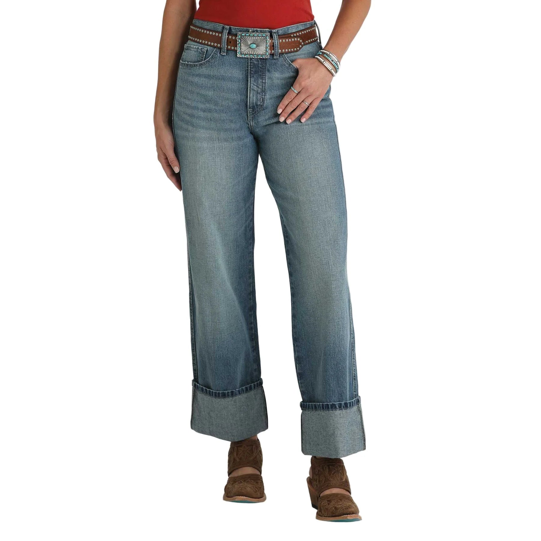Cruel Denim Casey Medium Stone High Rise Loose Jeans. Blue jeans worn by a person on a white background