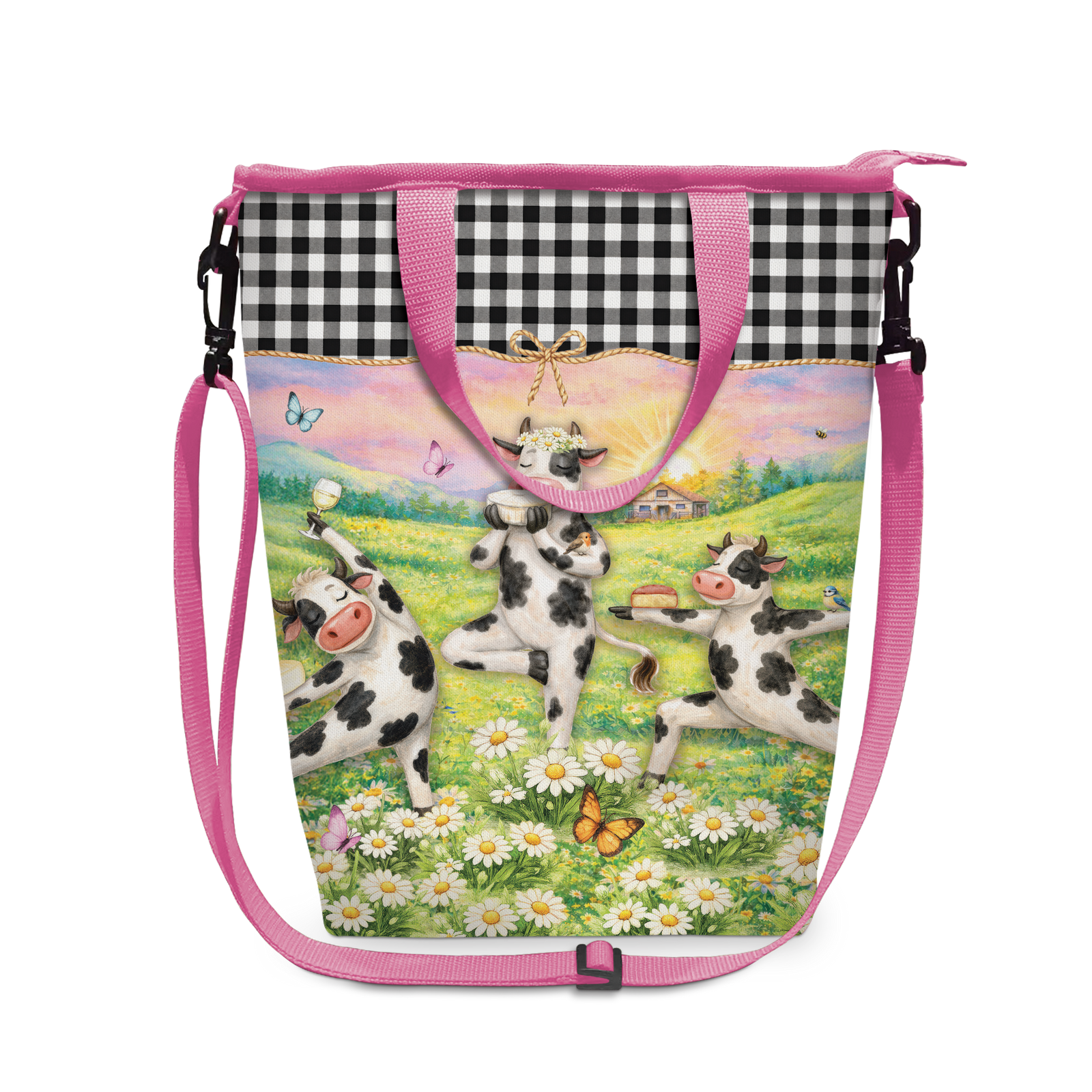 A drawstring shoulder bag with a vibrant illustration of a cow in a field of daisies, featuring a black and white gingham pattern on the upper section and a pink strap.