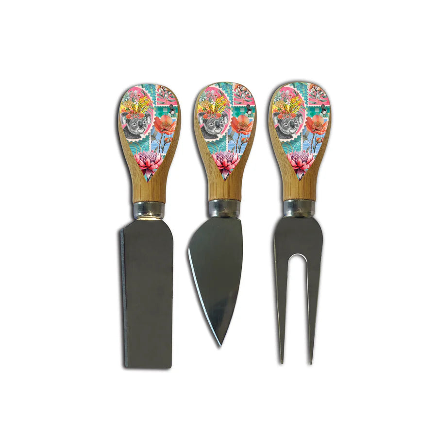 Lisa Pollock Pretty Postage BlockSet of three cheese tools with floral patterned handles on a white background 